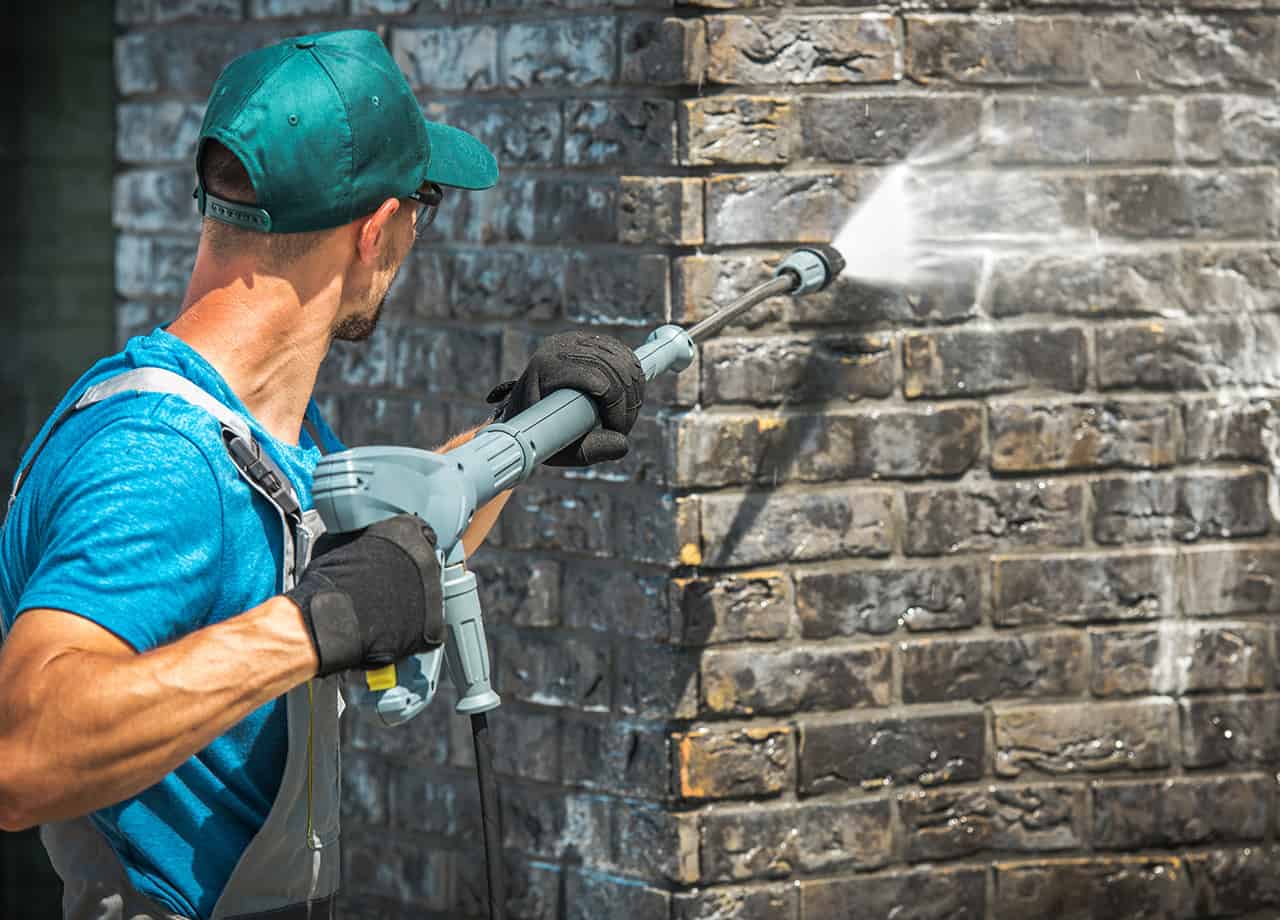 Power washing brick siding to remove debris and maintain its longevity. Roofing for Troops are brick siding experts serving the Milford OH & Cincinnati OH areas.