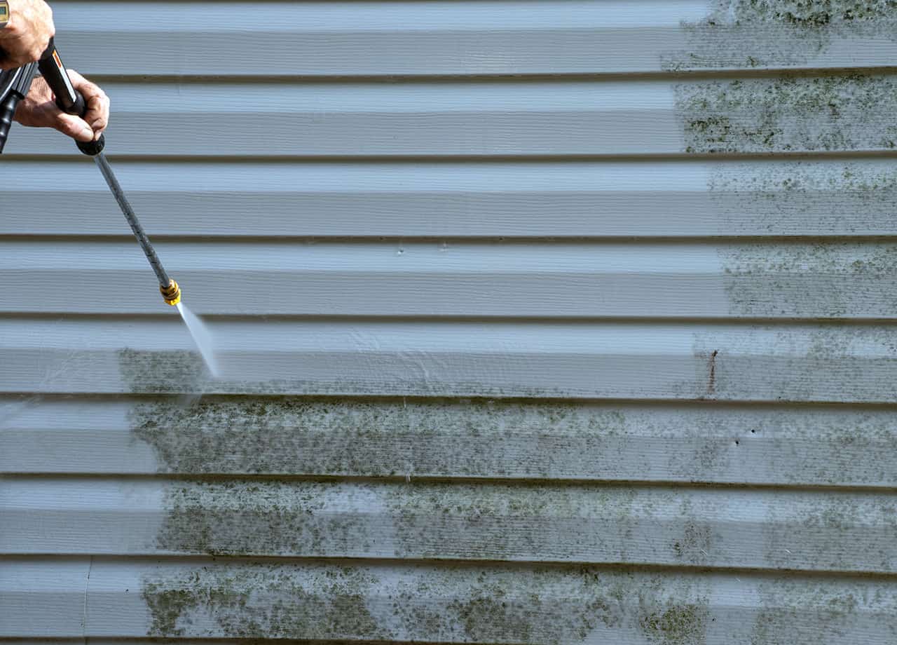 Power washing vinyl siding to remove dirt build up and debris. Cleaning and maintaining vinyl siding will improve the longevity and appearance of your vinyl siding. 
