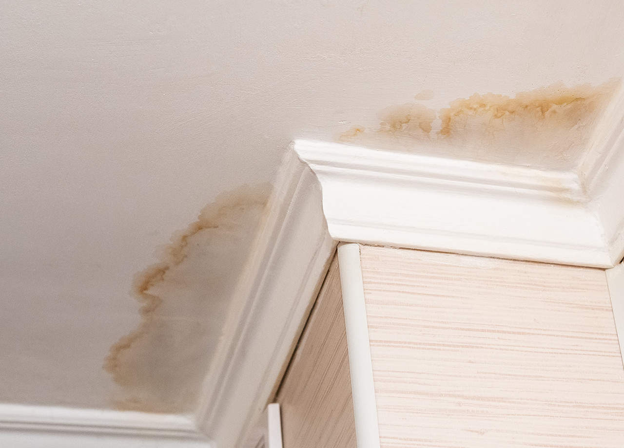 Image of water stains on a ceiling in a home due to a roof leak. Our roofing contractors in Milford OH & Cincinnati OH can repair roof leaks for your home.